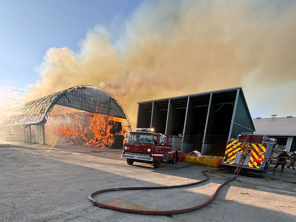 Several area fire departments help battle large barn blaze near Teeswater