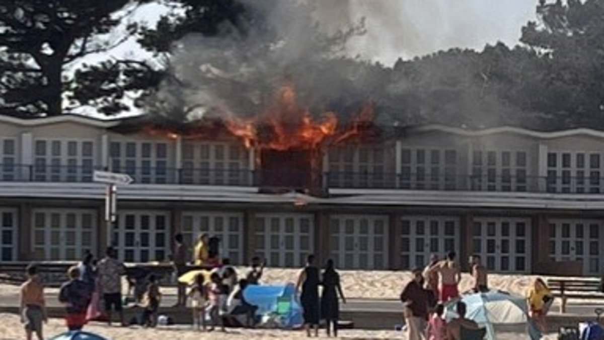 Beach hut worth £50,000 goes up in flames on millionaires' playground Sandbanks after blaze sparked by faulty cooker