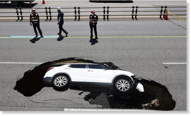 Elderly couple injured after their car falls into sinkhole in Seoul, South Korea