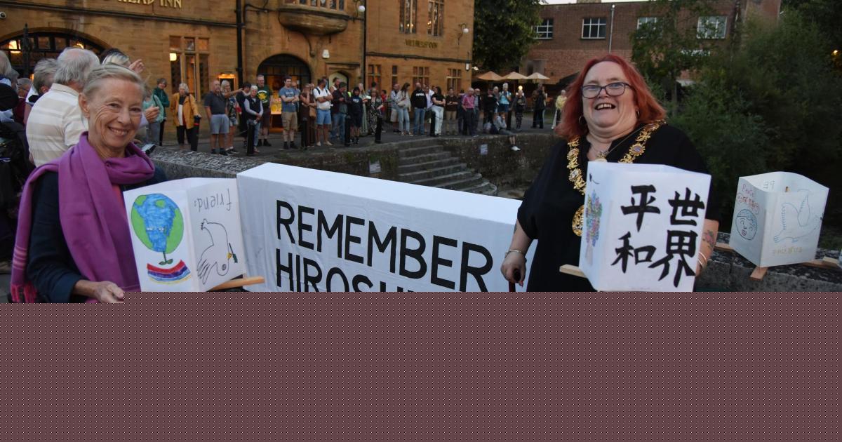 200 candles float down river in moving tribute on Hiroshima and Nagasaki Day