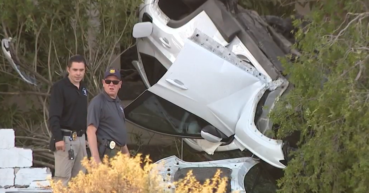 Woman dies after rollover crash into brick wall in Phoenix