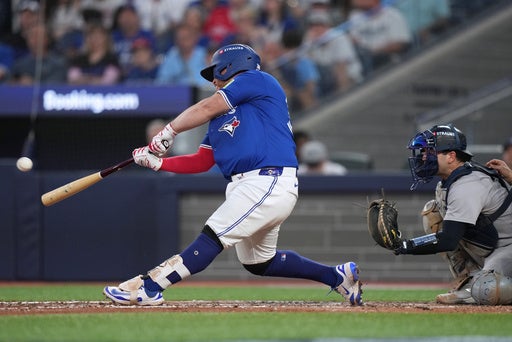 Kirk homers twice as Blue Jays end playoff skid by thumping Yankees 10-1 in Game 1 of ALDS