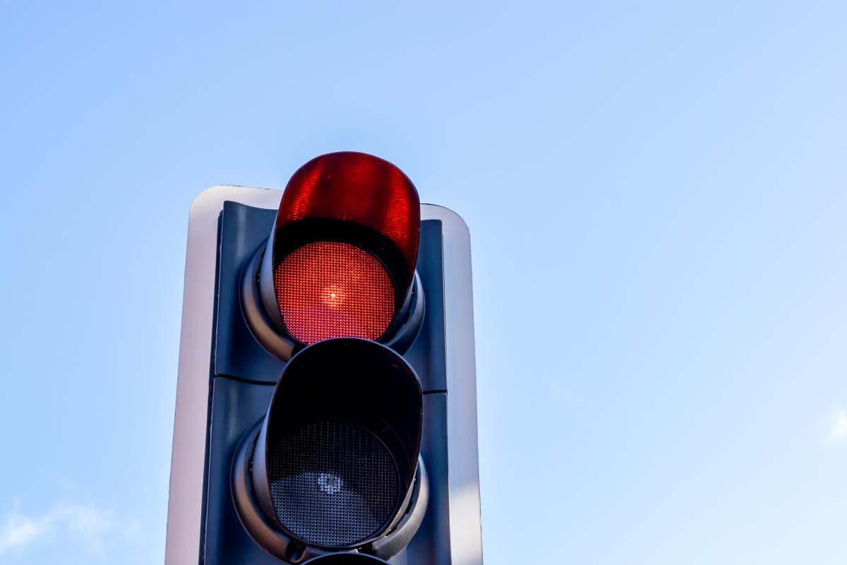 Scooter pair smash into car after running red light
