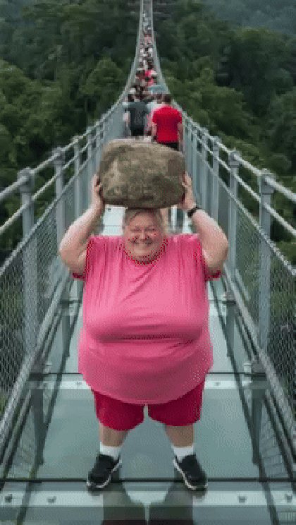 AI Lady With Rock Breaking Glass Bridge - GIF / Reaction