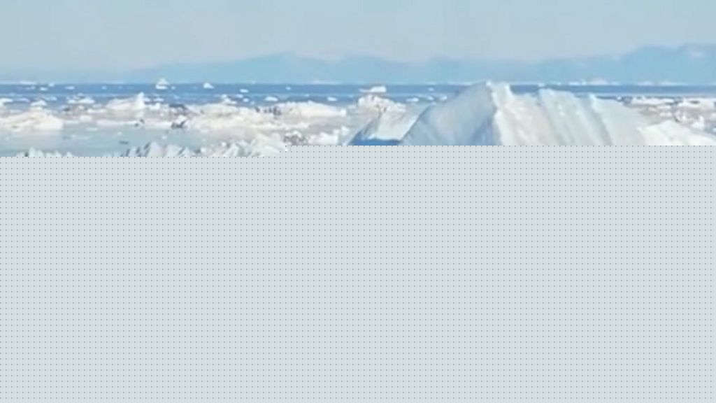 Watch: Giant iceberg turns over near  Greenland's coast