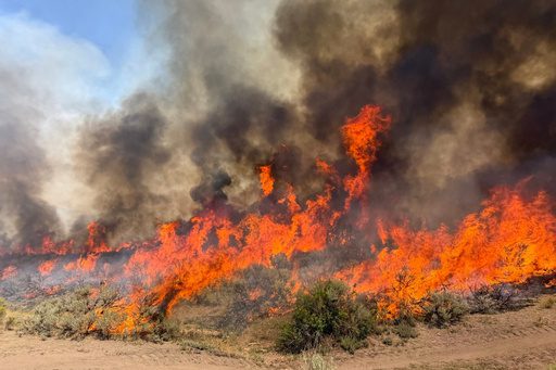 A helicopter battling a Utah wildfire crashes, with no word on the 2 aboard