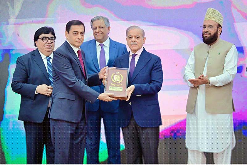 Prime Minister Muhammad Shehbaz Sharif presenting awards to the members of Religious Minorities of Pakistan who contributed towards the sustained benefits of the society