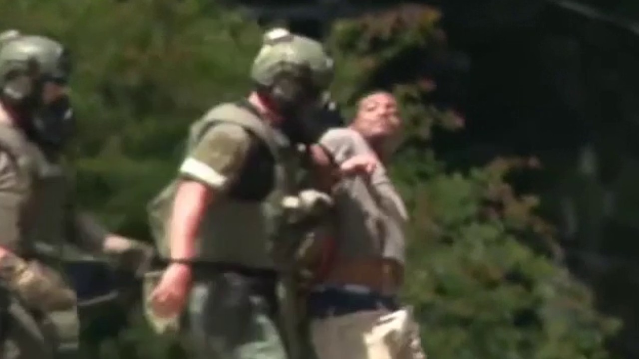 Tactical team arrests man with hammer in Douglas County