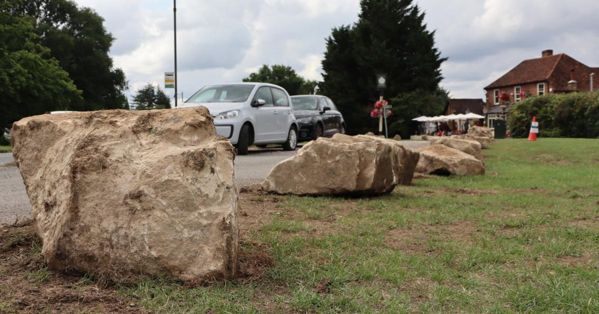 Removal of all 170 controversial boulders from village green recommended