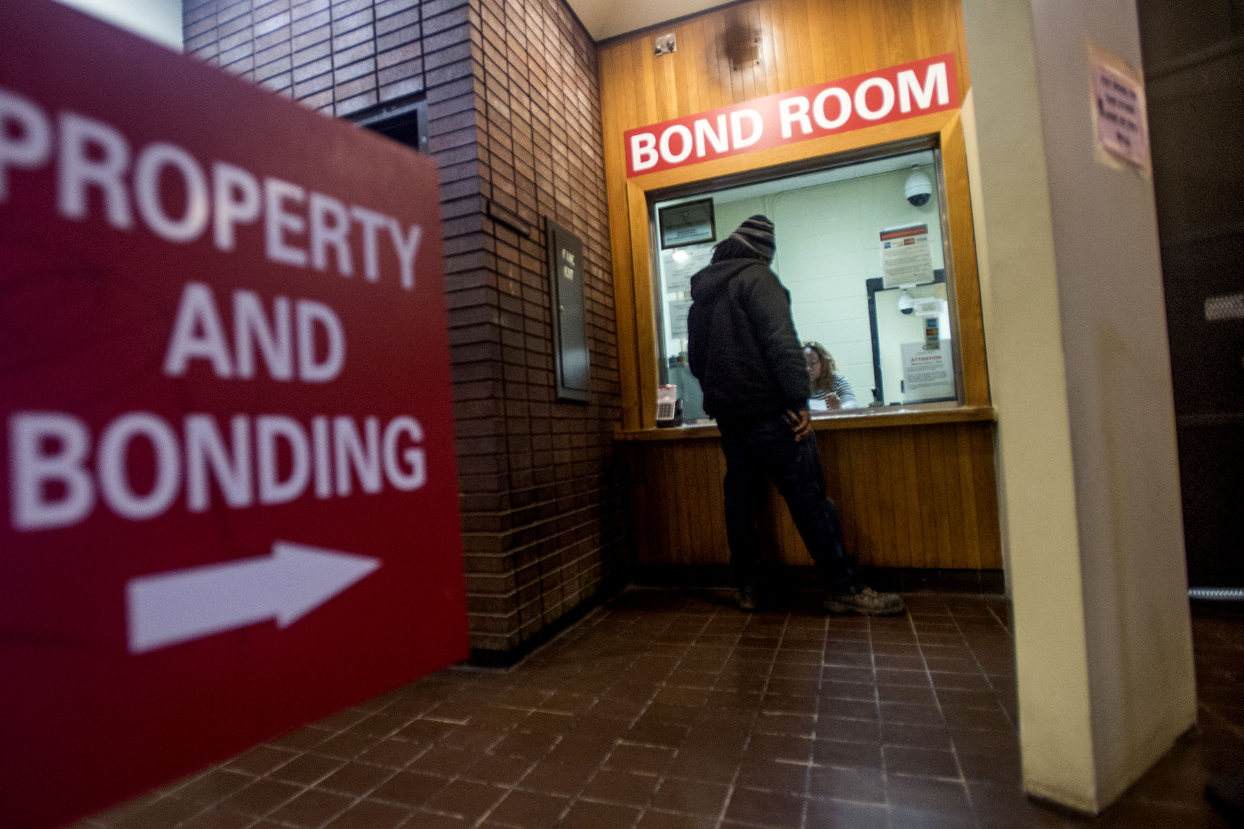 Trump says ending cash bail endangers women. Advocates say it protects them.