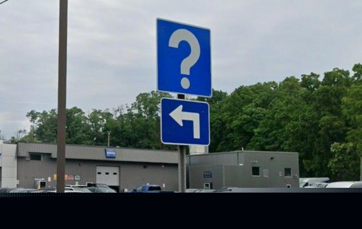 What Do Those Strange Blue Question Mark Road Signs Mean?