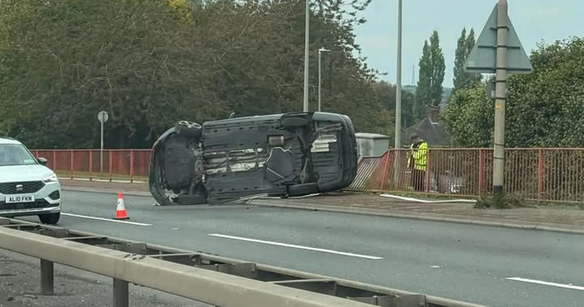 Trucker 'assisting police with their enquiries' after car overturns in A50 crash