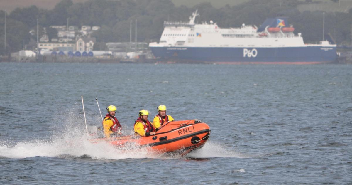 Off-duty RNLI volunteer praised for rescuing three people from capsized boat