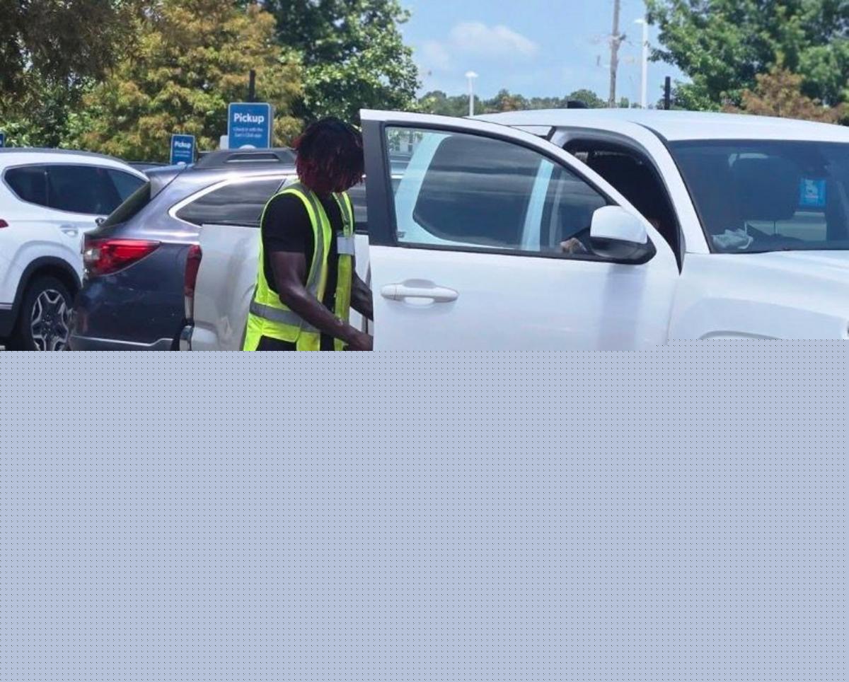 See The Viral Photos of Young Louisiana Man Assisting an Elderly Woman