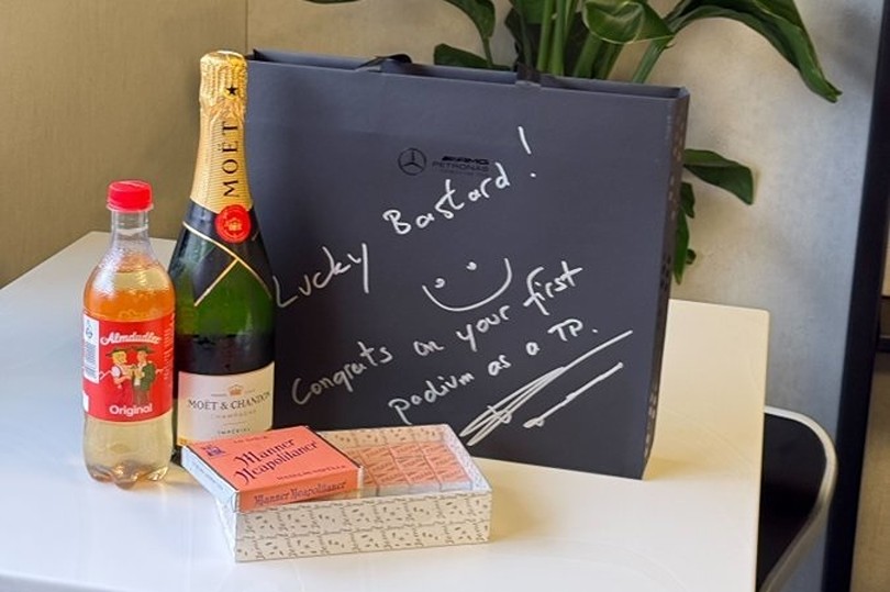 Wolff salutes Vowles big day with Moët, treats and sass!