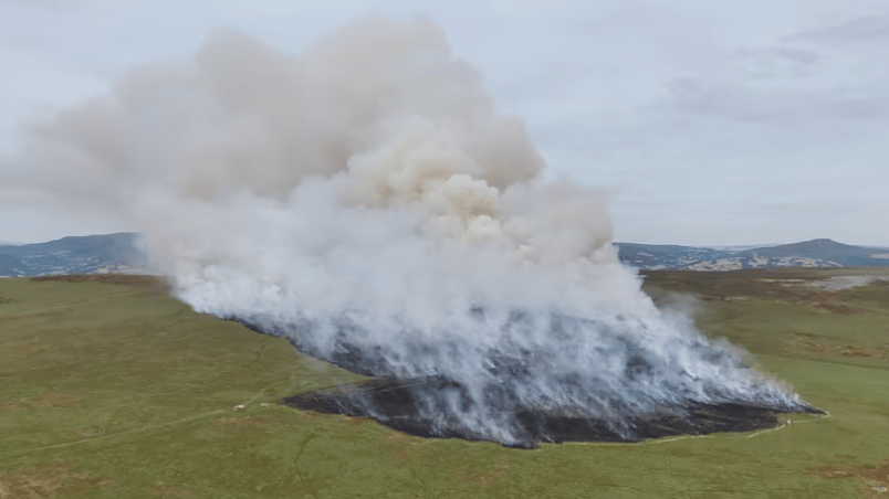 Helicopter drafted in to help tackle Llangynidr mountain fire as crews expect to stay for 'a few days'