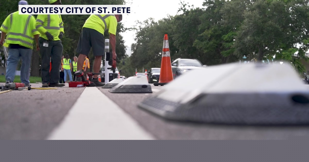 Crews place protective dividers along St. Petersburg bike lanes