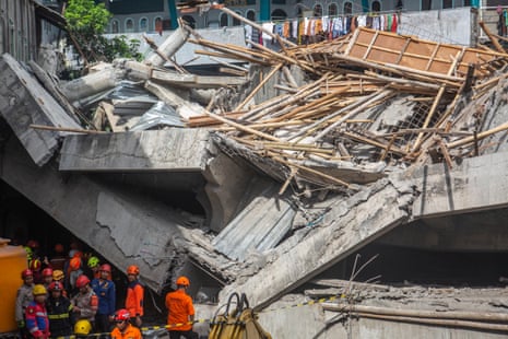 Indonesia school collapse: one dead, 65 buried under rubble as rescuers race to find survivors