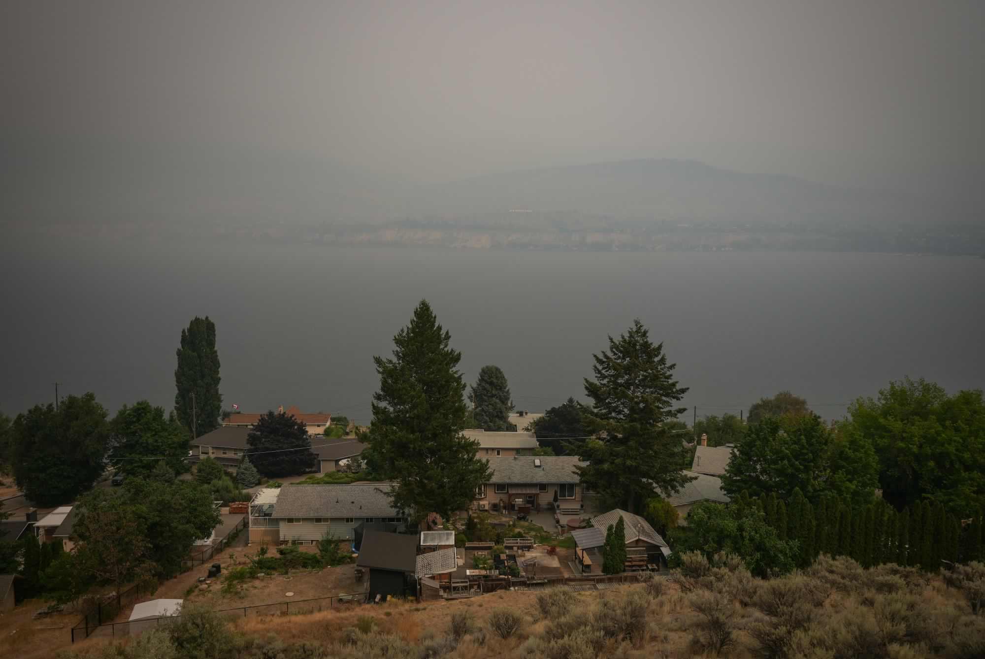 Canada puts the military on standby as British Columbia wildfires kill 1 and displace thousands