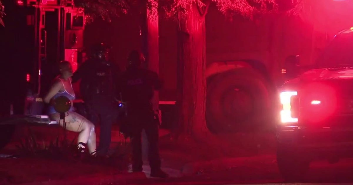 Detroit woman accused of pointing gun at children, barricading herself in home