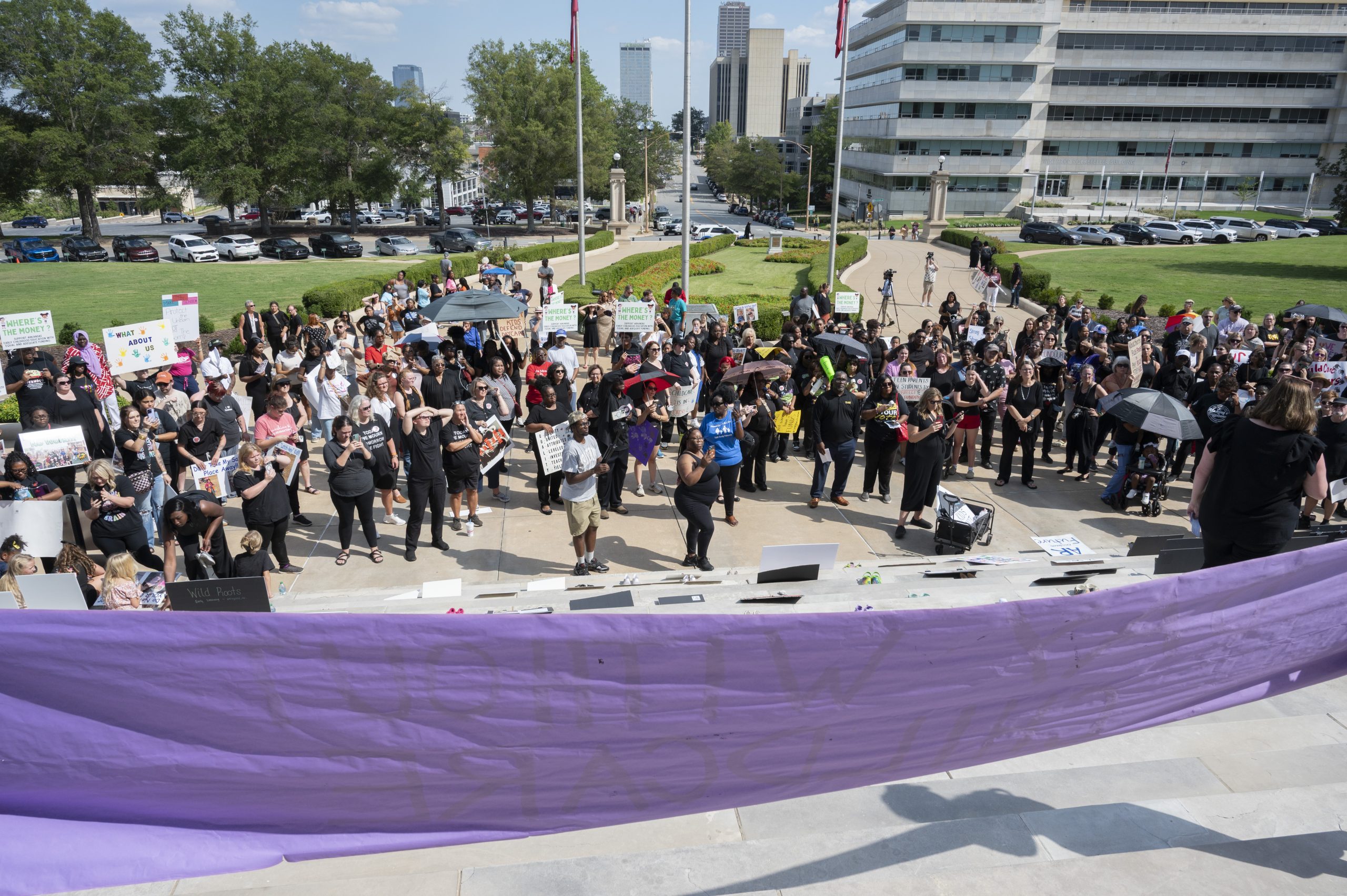 Slideshow: Child care providers, advocates rally against funding cuts