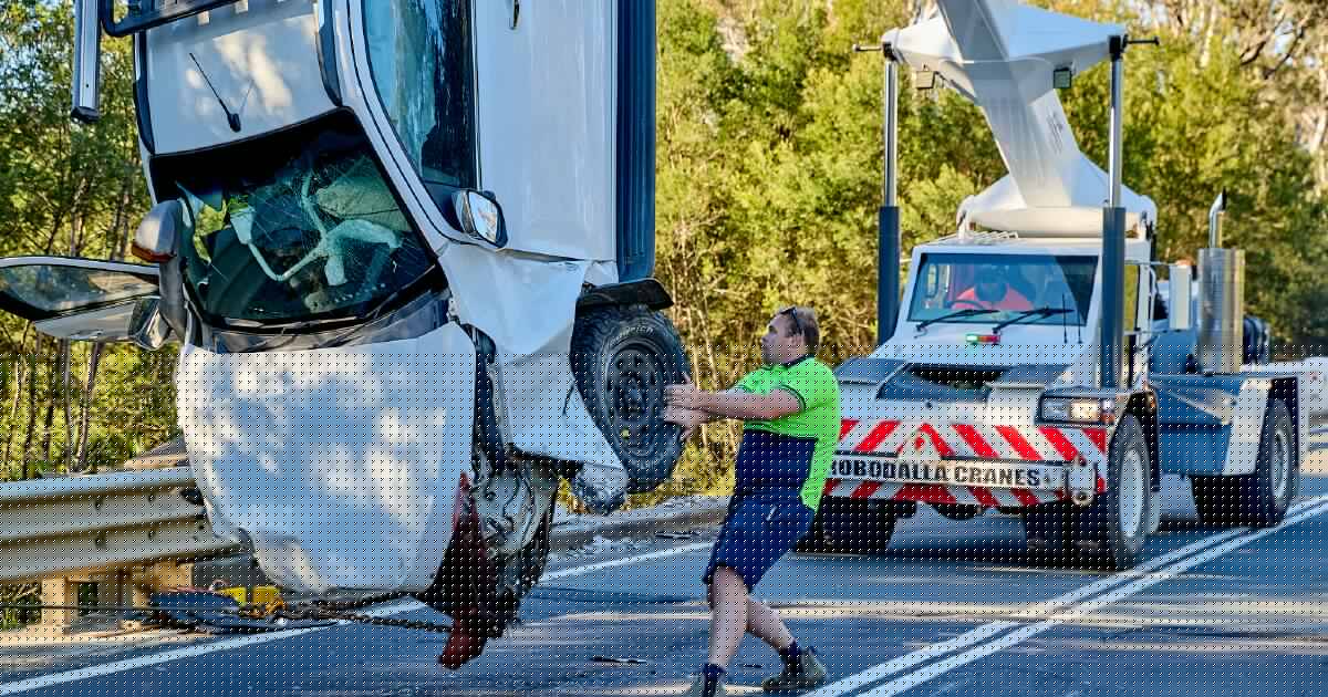 Car hangs from bridge after single-vehicle crash, Princes Highway closed