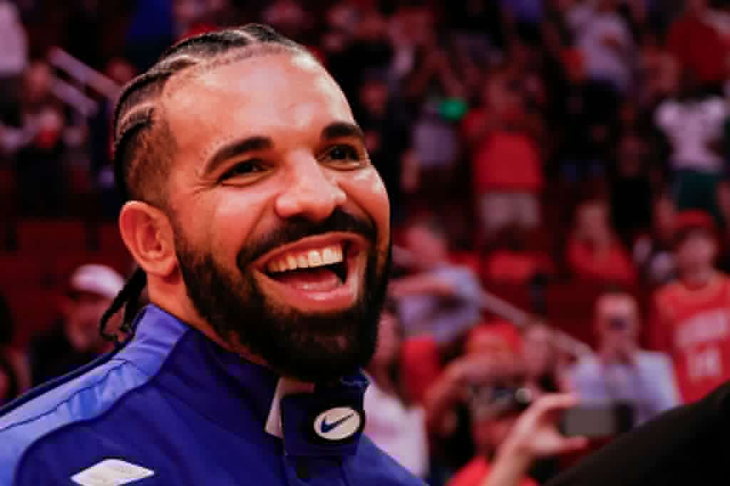 Drake Flamed For Rocking Vintage Chanel Overalls At Beer-Chugging Oktoberfest