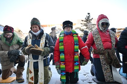 Photos of the Week: Clergy mobilize against ICE, Hindu Magh Mela festival