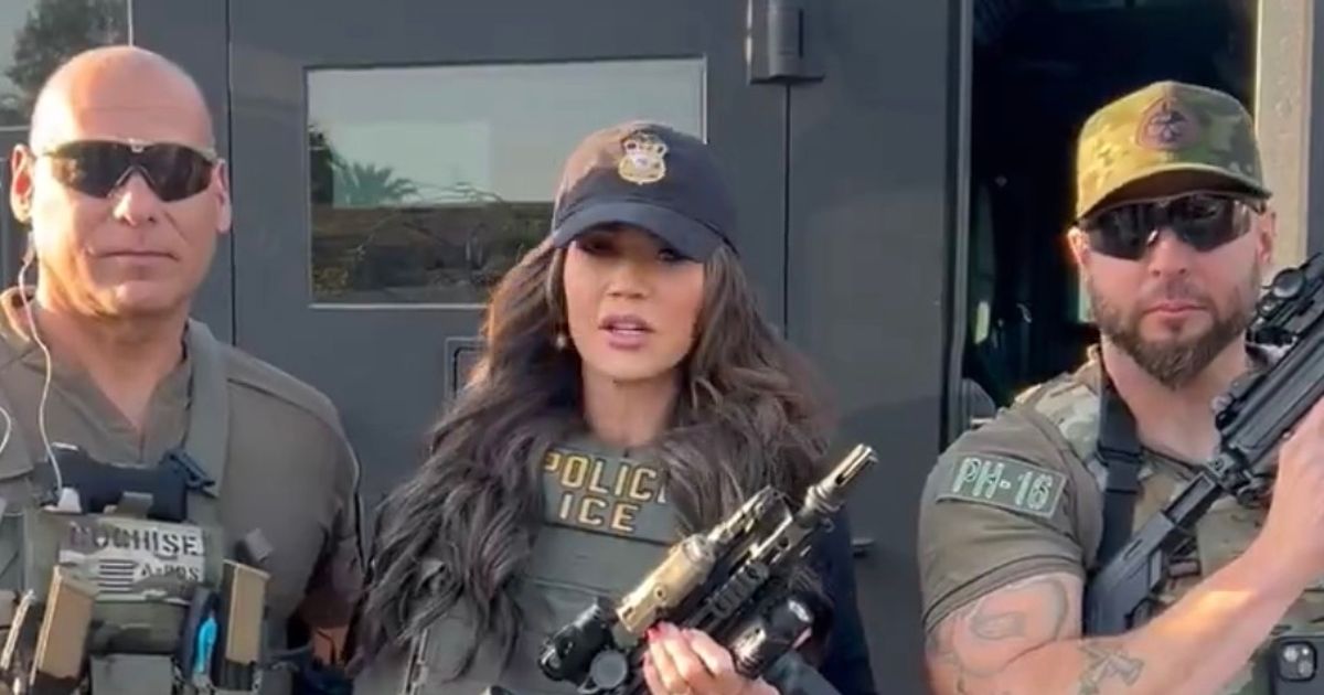 Kristi Noem slammed for ‘reckless cosplay’ as she ‘points rifle at ICE agent’s head’