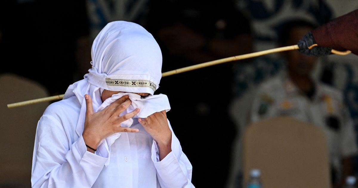 Horror pics of woman lashed 140 times in public caning for sex 'outside marriage'
