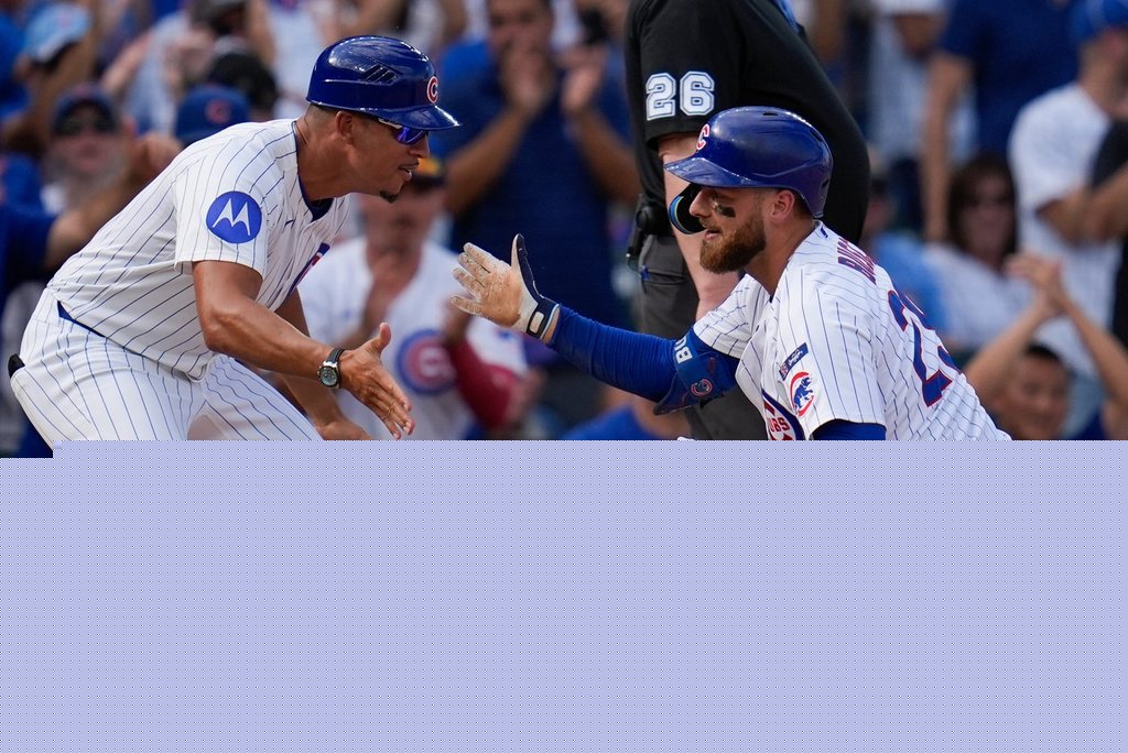 Busch stars as the Cubs beat the Cardinals 7-3 to clinch the top NL wild card
