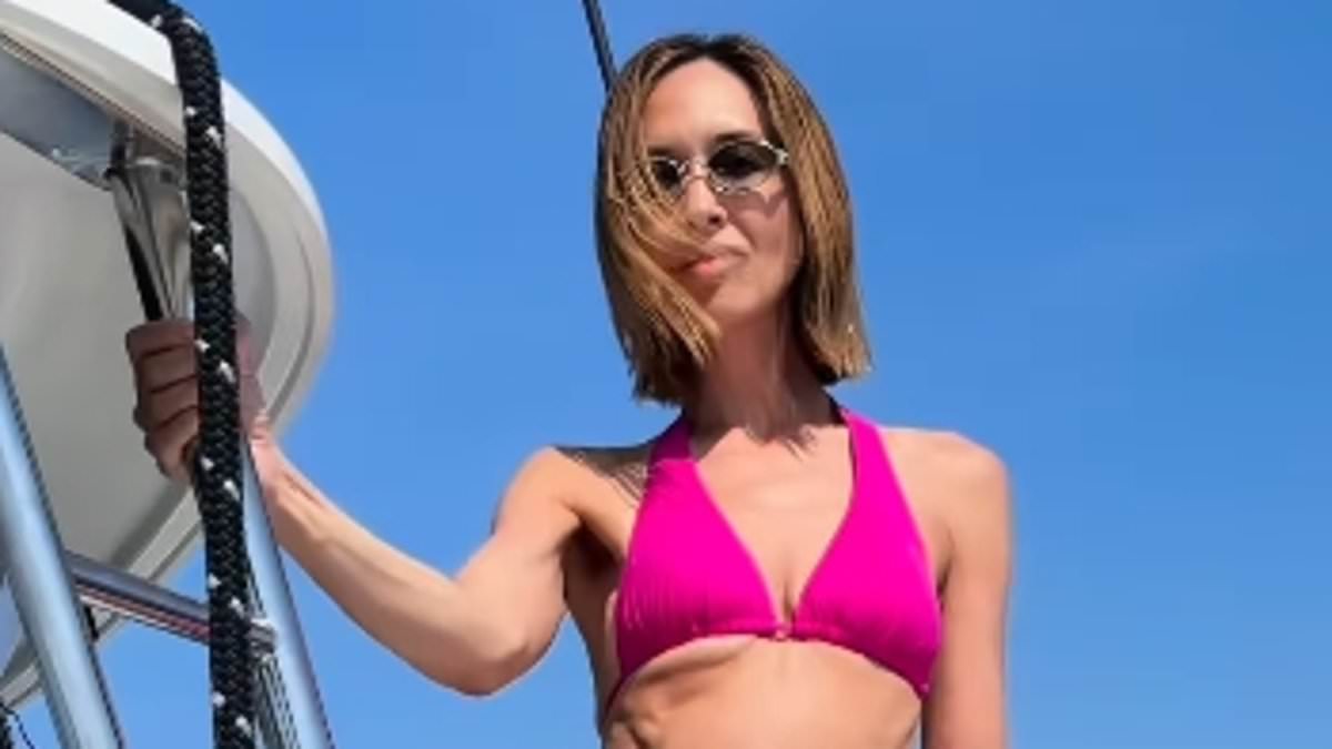 Myleene Klass, 48, looks joyous as she models a number of bikinis during a celebratory yacht trip after 'terrifying' breast cancer scare