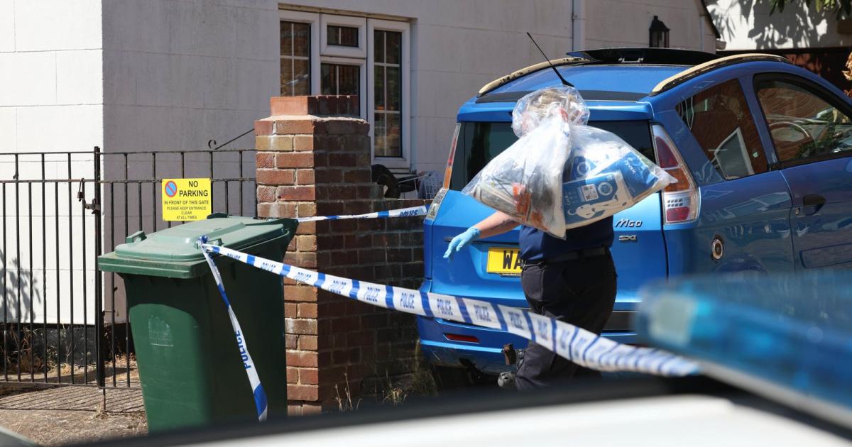 Forensic teams remove bags from block of flats - in pictures