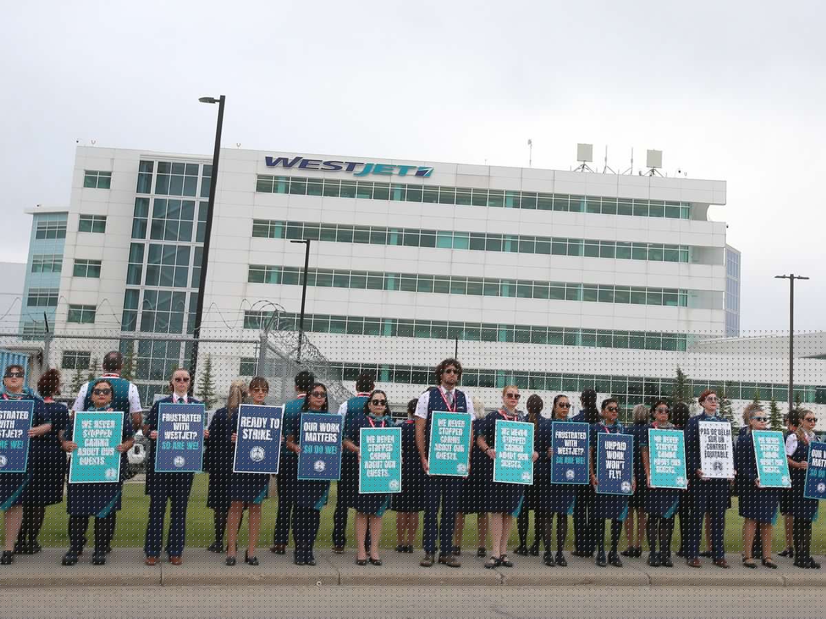 Striking WestJet flight attendants say 13% pay bump, ‘duty pay premium’ for pre-flight work not enough