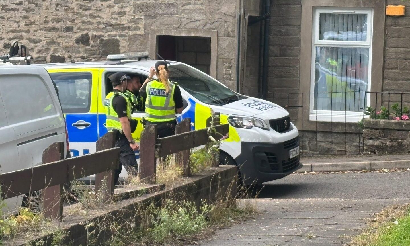 Police swarm Dundee street amid major search operation