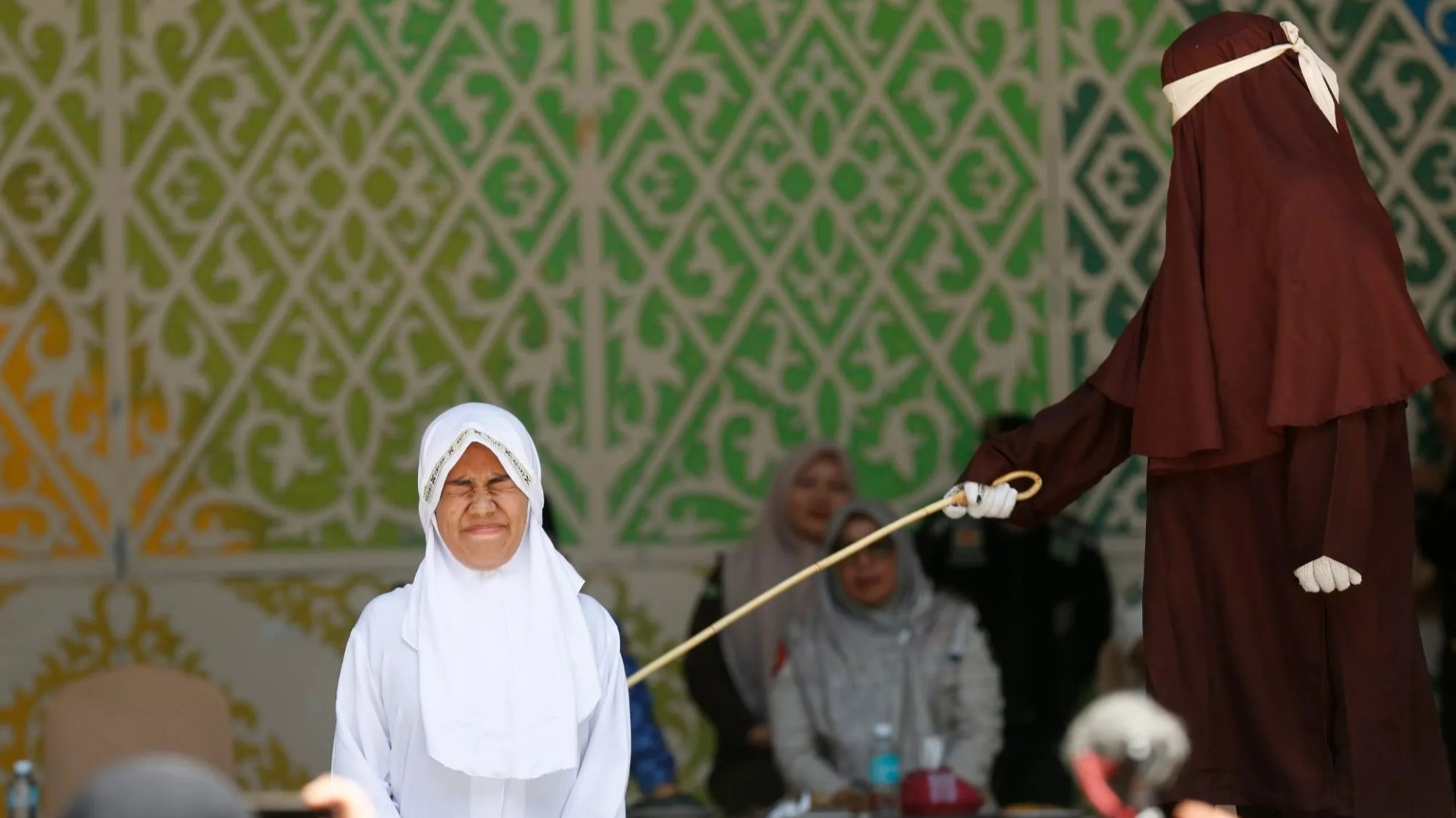 Brutal moment woman FAINTS after being lashed 140 times in agonising Sharia punishment for having sex outside marriage