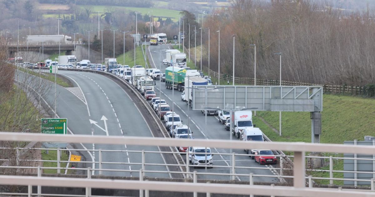 Woman dies and three seriously injured following A55 crash between lorry and car