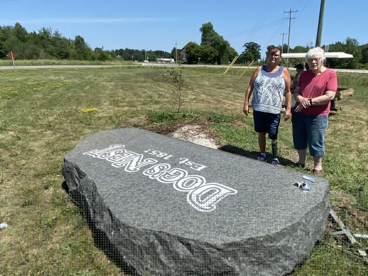Vehicle topples large, granite Dog's Nest monument