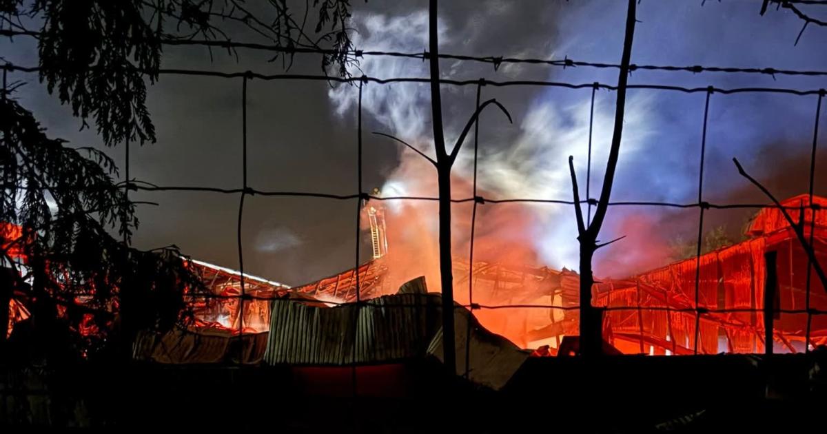 Huge farm fire enters second day with crews still at the scene