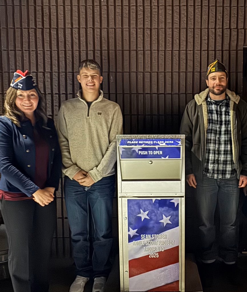 Eagle Scout places flag disposal boxes