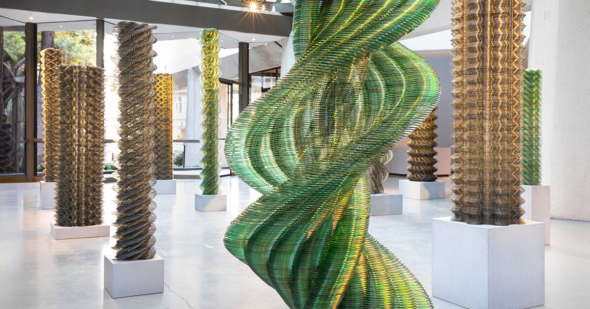 thousands of recycled CDs form reflective vertical sculptures in tara donovan’s stratagems