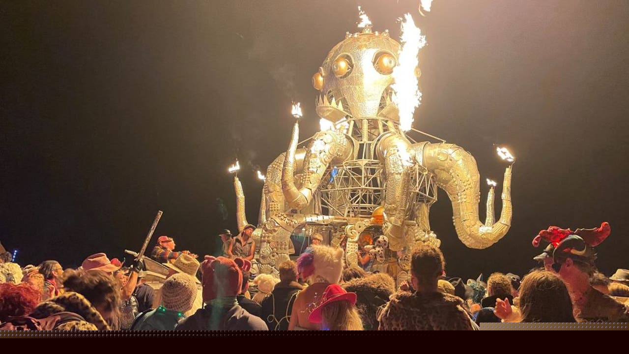 What other strange events are reportedly happening at Burning Man as police hunt a killer?