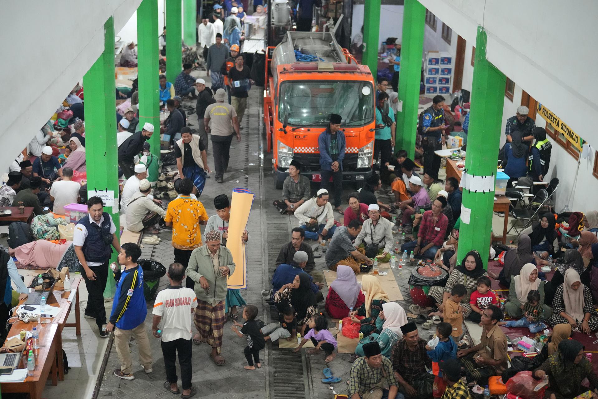 Rescuers search for 59 people trapped under collapsed Indonesian school