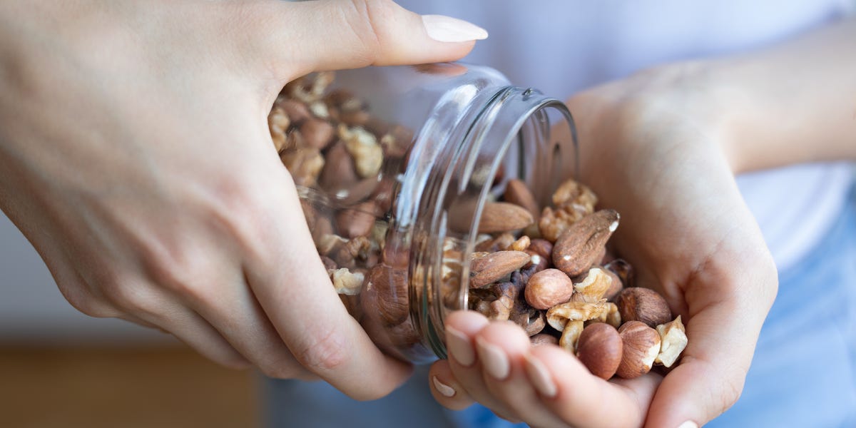 This Is What Happens to Your Body When You Eat Too Many Nuts, According to Experts