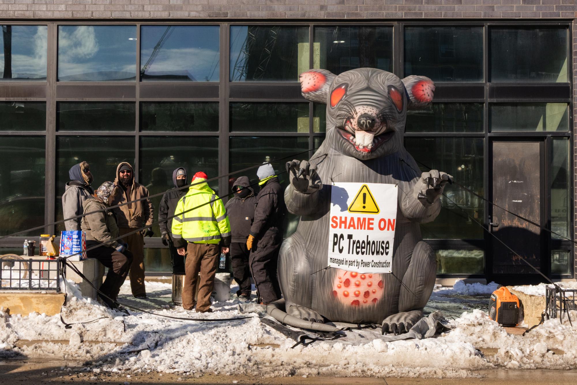 Union workers protest construction company outside high-rise project