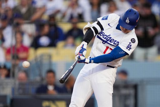 Ohtani hits 2 homers for Dodgers in playoff opener against Reds