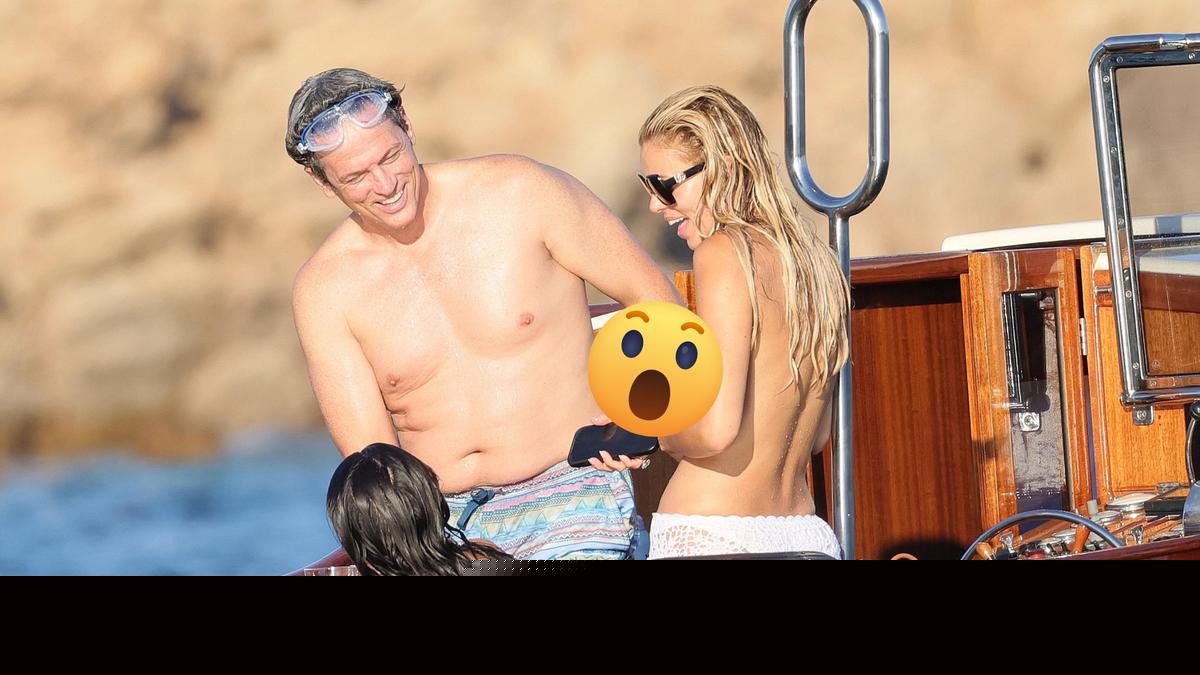 Model Brooks Nader ditches bikini top while on boat with parents in Italy