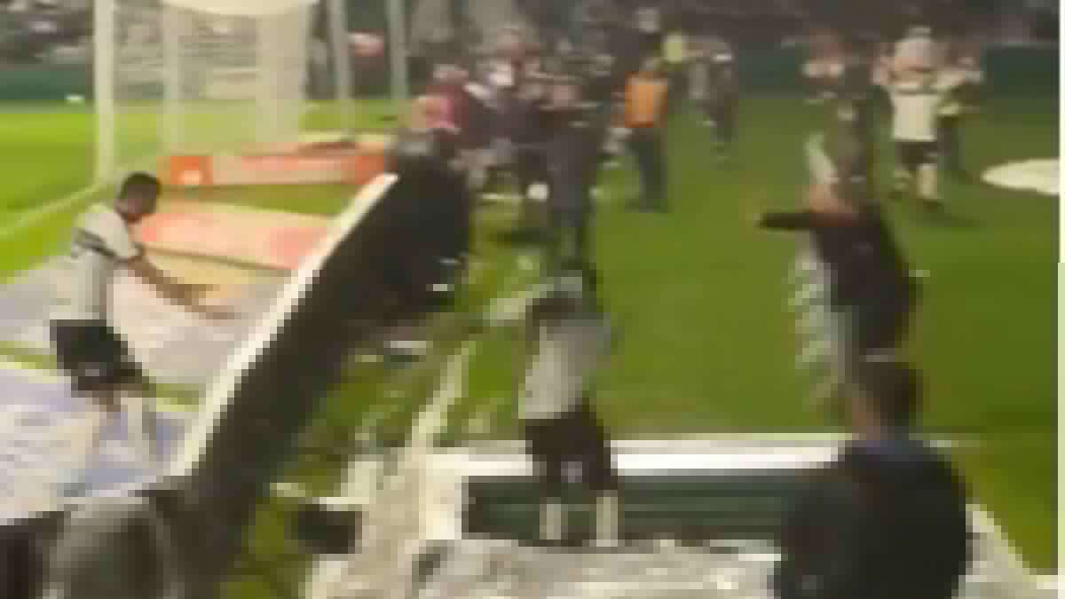 Horrifying moment footballer plummets down a hole in the ground while celebrating a goal... only for it to be ruled out for offside!