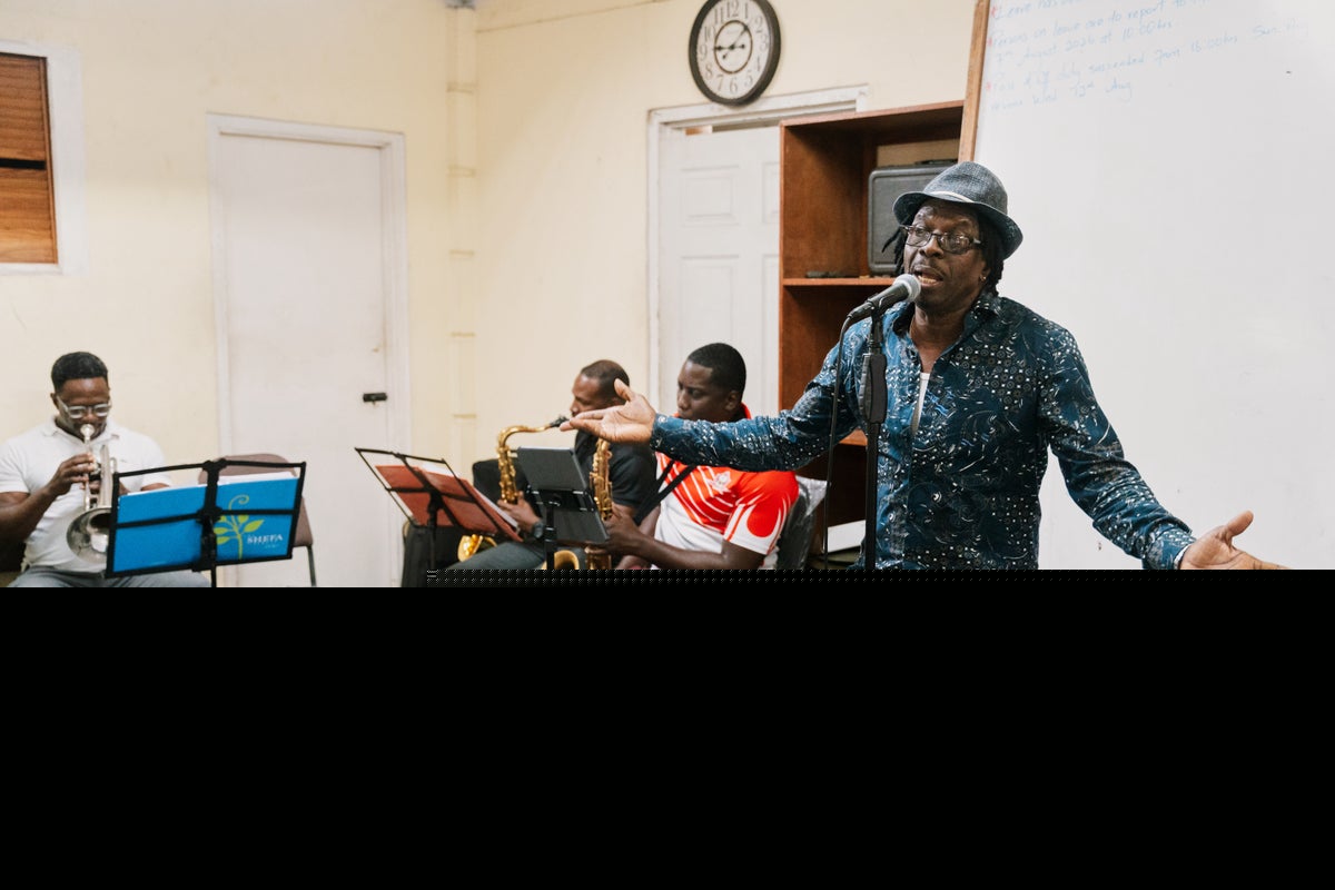 Suspended priest on tiny Caribbean island turns to music to make his voice heard