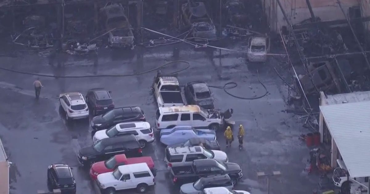 Cars damaged after early morning fire at Valencia dealership
